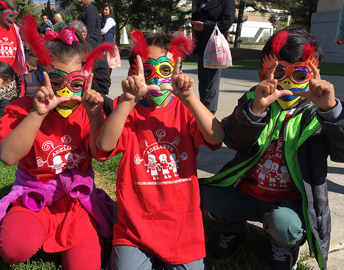 Children wearing swoop masks